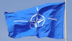 NATO flag flying at NATO Headquarters Brussels.