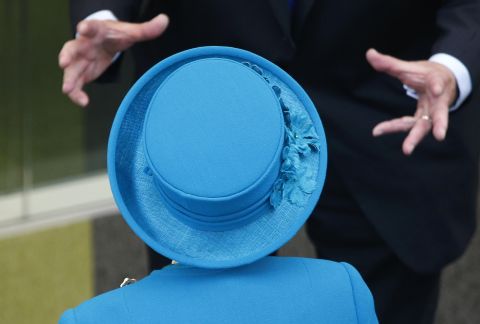 <strong>October 15:</strong> Britain's Queen Elizabeth II, foreground, talks to a guest at the University of Surrey, where she officially opened a state-of-the-art veterinary school in Guildford, England.