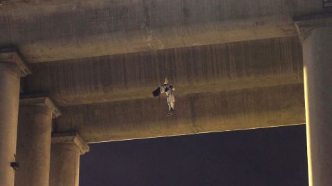 <strong>October 19: </strong>A dead man hangs from the waist under a Mexico City overpass. This is the first time a body has appeared on a bridge or overpass in Mexico's capital. It is a common practice among gangs fighting for turf in other regions of Mexico.