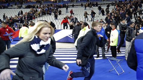 <strong>November 13:</strong> Spectators run onto the soccer field at the Stade de France stadium, one of the targets of <a href="http://www.cnn.com/2015/11/14/world/what-happened-in-paris-attacks-timeline/" target="_blank">the Paris terror attacks</a> that killed at least 130 people and wounded hundreds more. The militant group ISIS has claimed responsibility for the attacks, which also hit a concert hall and popular restaurants.