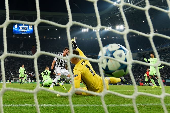 Mario Mandzukic scores the match-winner for Juventus as they beat Manchester City 1-0 to qualify for the Champions League knockout stages. 