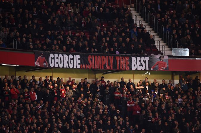 Manchester United fans display a banner remembering club legend George Best, who died on 25 November 2005, as they drew 0-0 at home to PSV. 