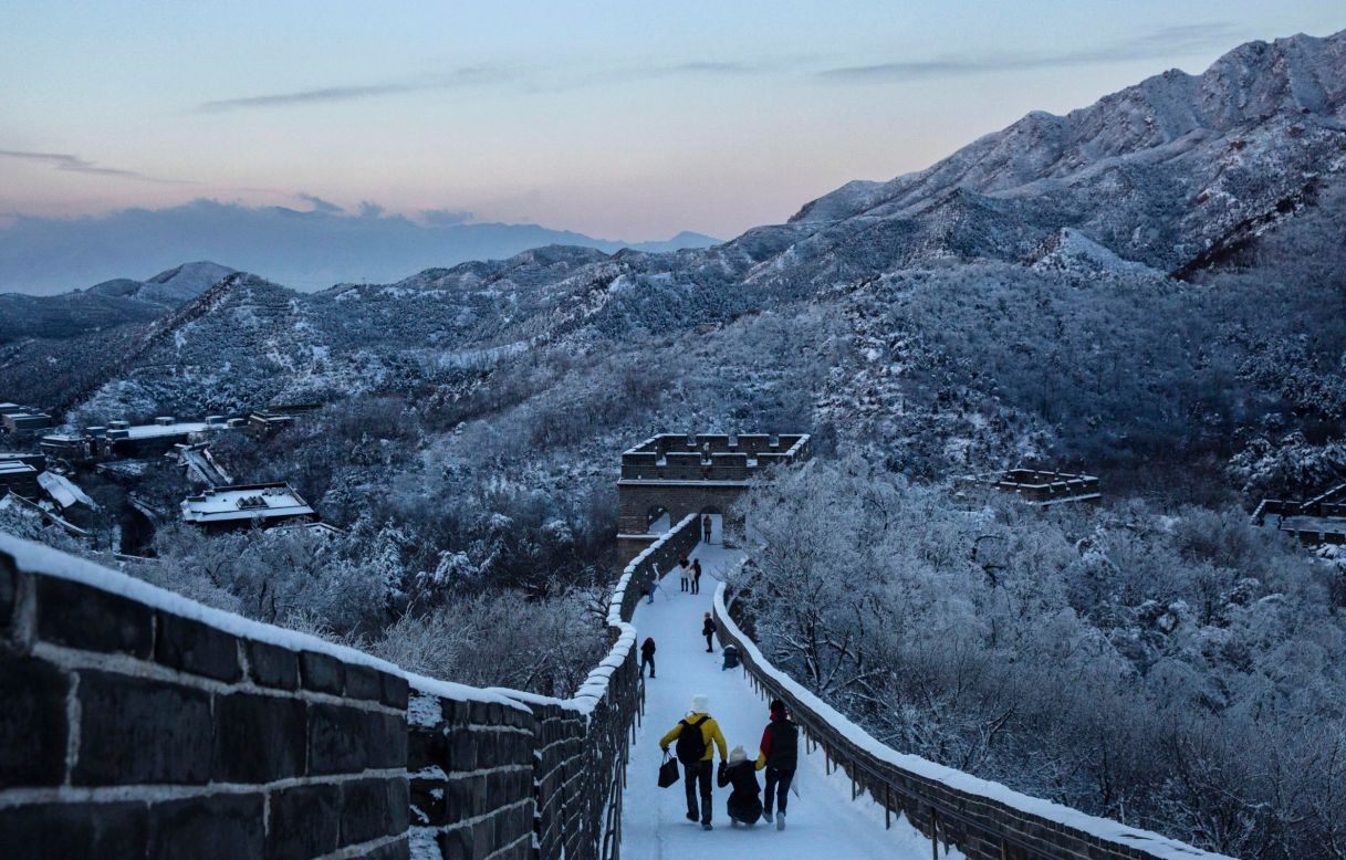 For some tourists taking on the snow-clad Great Wall near Beijing on November 23, the snow seemed more of a trial than a welcome treat.