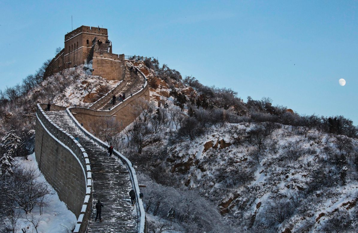 Snow starts to melt while the moon rises over the Great Wall near Beijing on November 23.