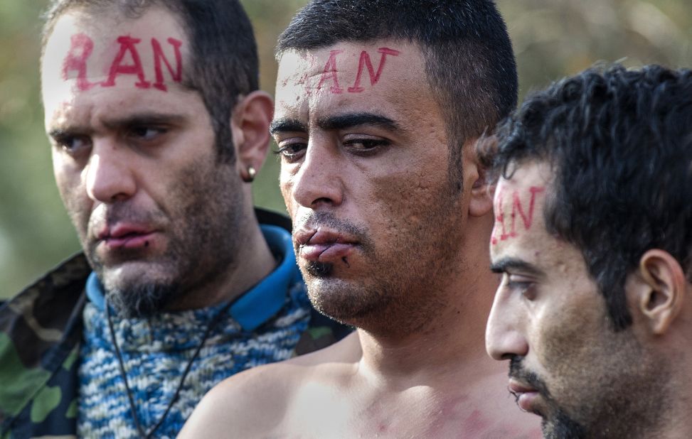 The 'Iranian' men are protesting the Macedonian government's decision to only allow Syrians, Iraqis and Afghans -- those fleeing war - to pass across the border.