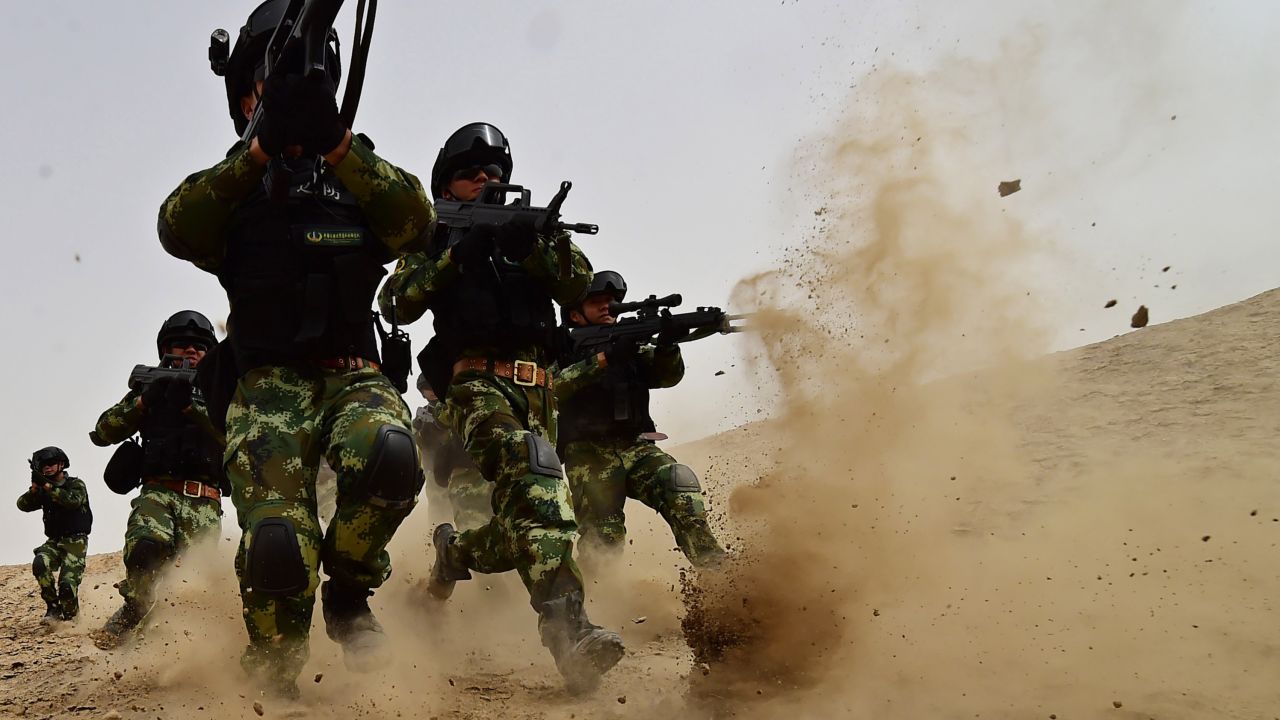  Soldiers of Xinjiang Armed Police Frontier Corps get drill in gobi desert of Yecheng County on August 17, 2015 in Kashgar, Xinjiang.