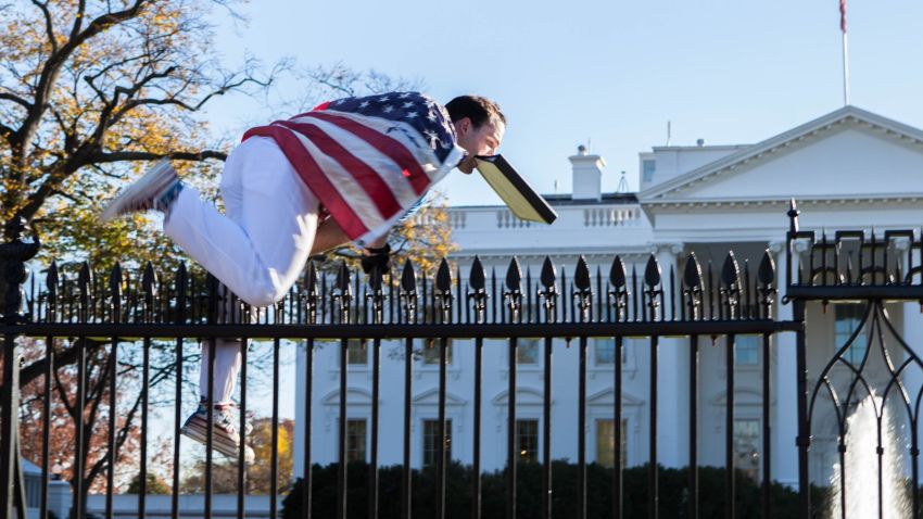 A person draped in an American flag jumped the fence on the North side of the White House, prompting a lockdown. He was apprehended by Secret Service.