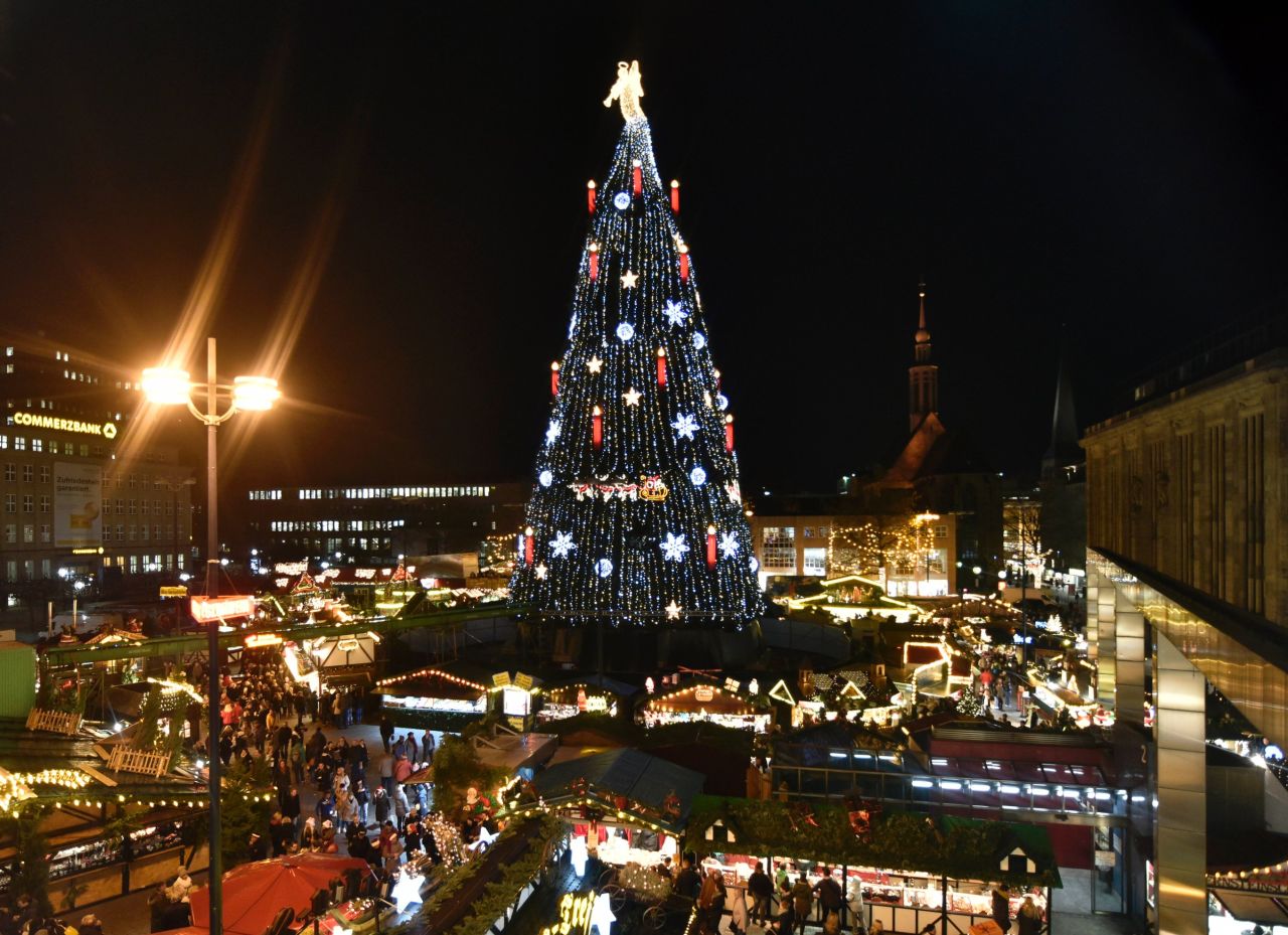 Germany's biggest Christmas tree is illuminated with 48,000 lights at the traditional holiday market in Dortmund. The 45-meter (148-foot) tree was built using 1,700 smaller trees.
