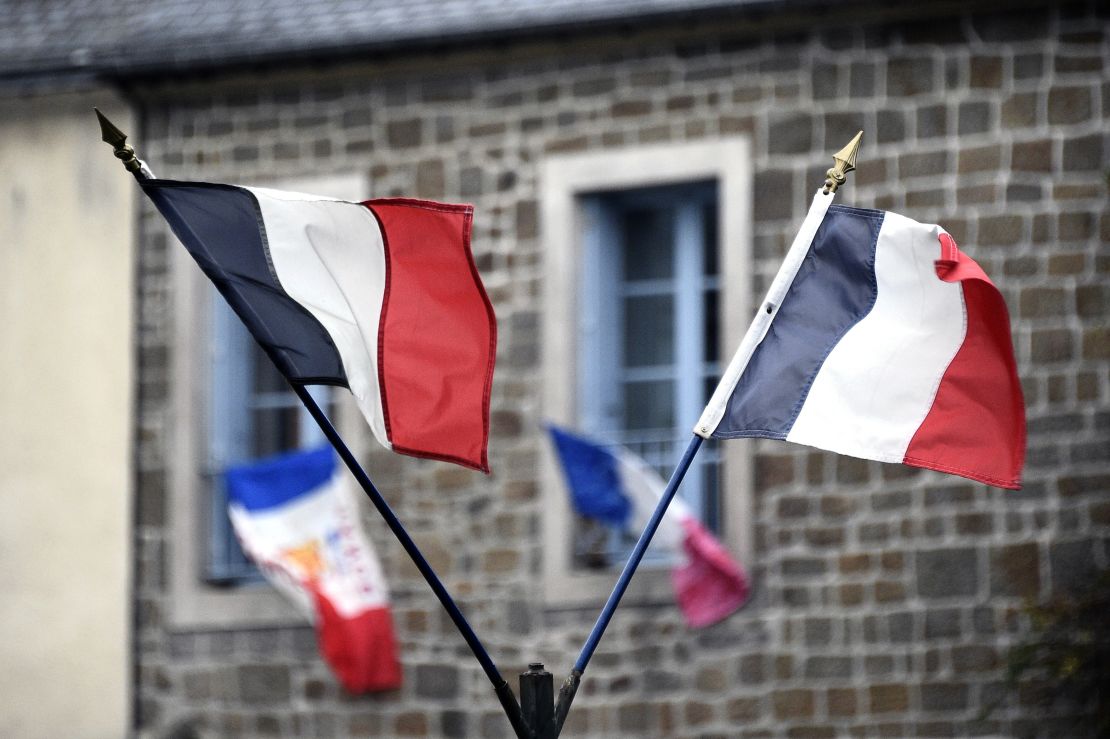 French national flags hang in the streets on Friday, November 27.
