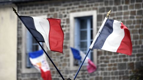 French national flags hang in the streets on Friday, November 27.