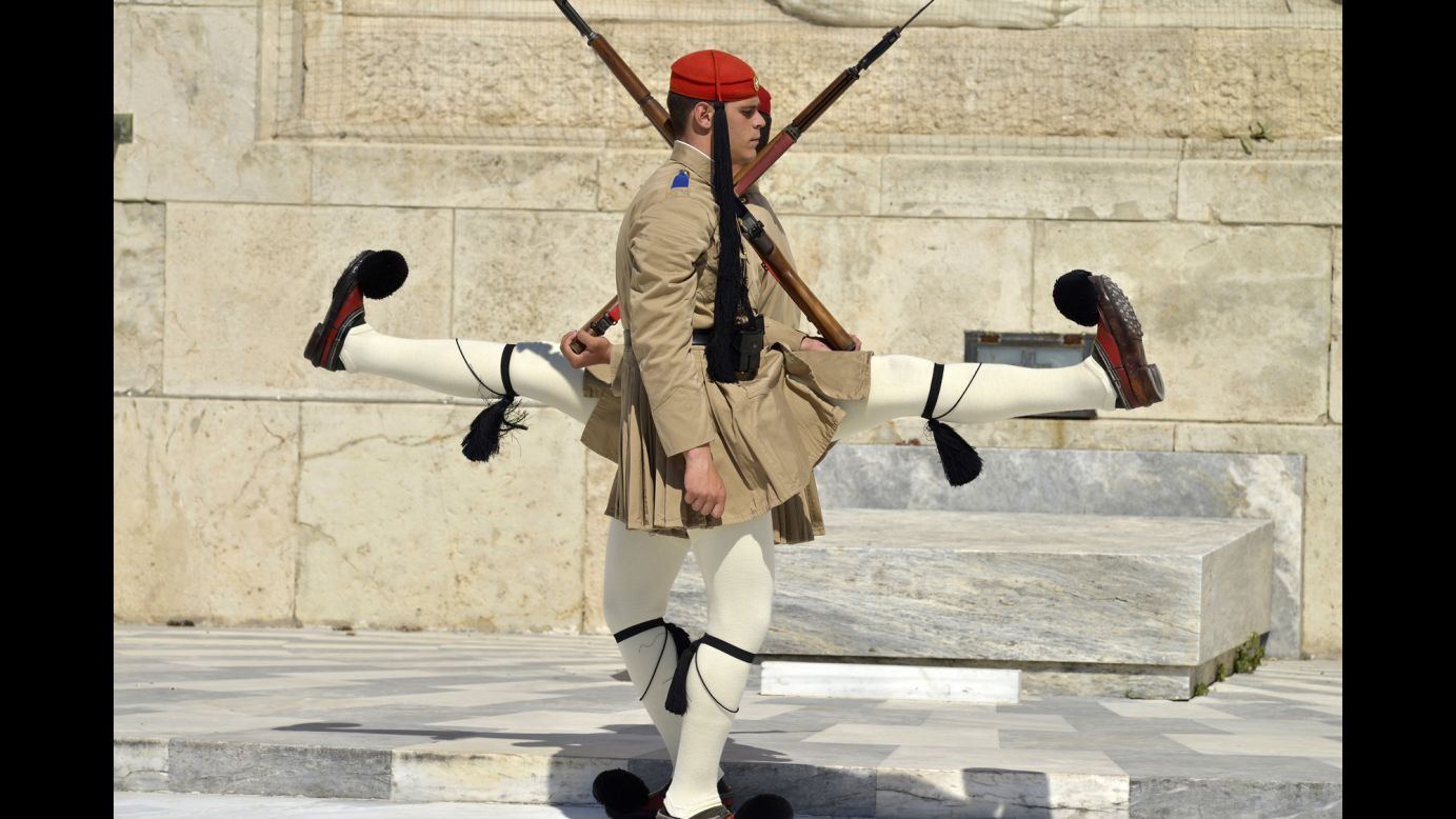 <strong>April 7:</strong> Honor guards march in front of the Tomb of the Unknown Soldier outside Greece's Parliament in Athens.