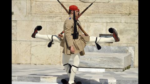 <strong>April 7:</strong> Honor guards march in front of the Tomb of the Unknown Soldier outside Greece's Parliament in Athens.