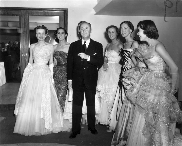 Couturier Christian Dior caused an international frenzy in 1947 when he introduced the "New Look," an hourglass silhouette that had all but disappeared from fashion during WWII. (Pictured: Christian Dior with models at London's Savoy Hotel, 1950)