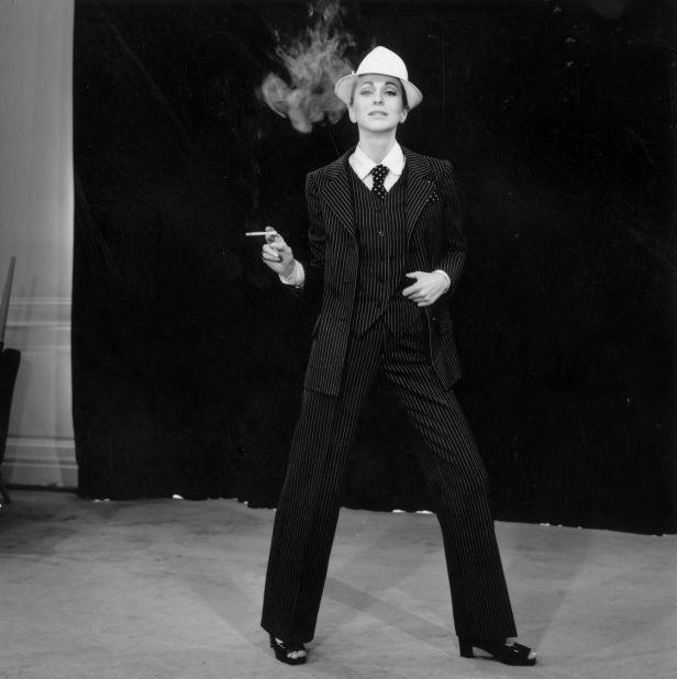 He's commonly credited for legitimizing ready-to-wear in the eyes of fashion's elite. But in terms of design, the creation of "le smoking," a tuxedo for women, was what he was most notorious for. (Pictured: A model wears a pinstripe Yves Saint Laurent smoking, 1967) 