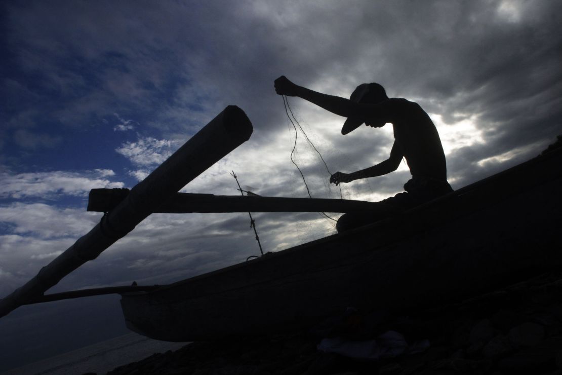Fisherman in the Coral Triangle prepare their nets before taking off to sea. For generations coastal communities have relied on the wide range of fish available in this diverse marine area.