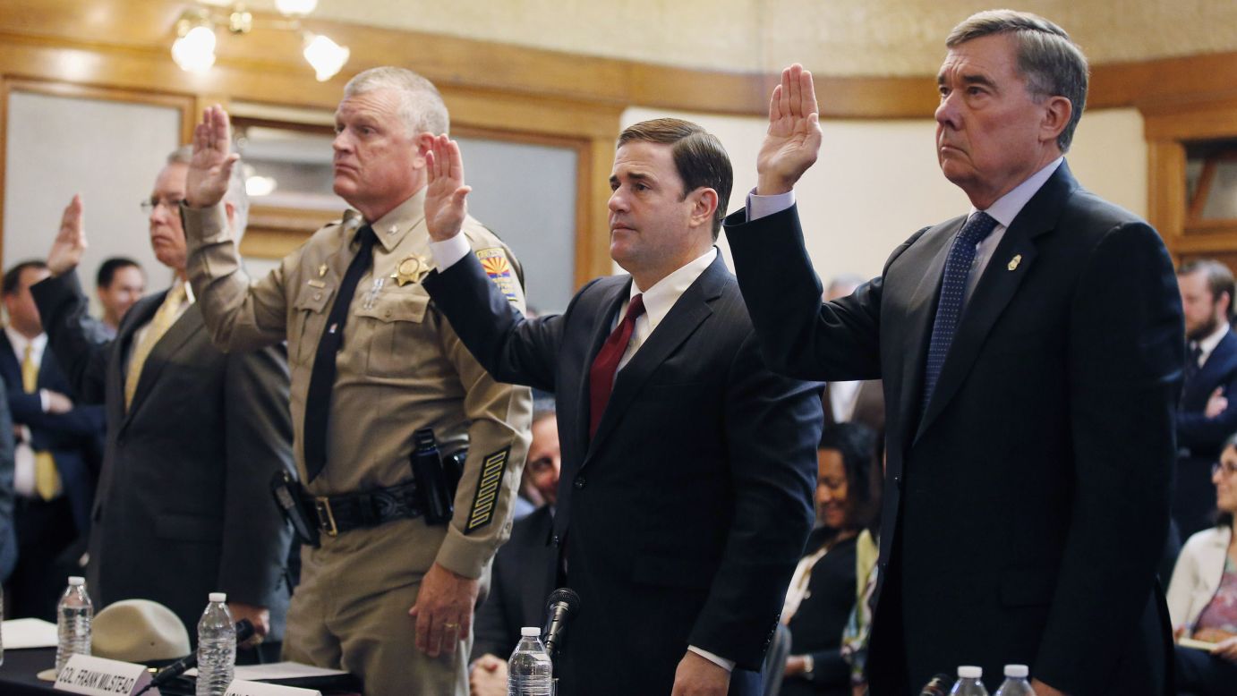 Arizona Gov. Doug Ducey, second from right, is sworn in with other officials during a U.S. Senate committee hearing in Phoenix on Monday, November 23. The hearing addressed border issues with Mexico, including drug smuggling.