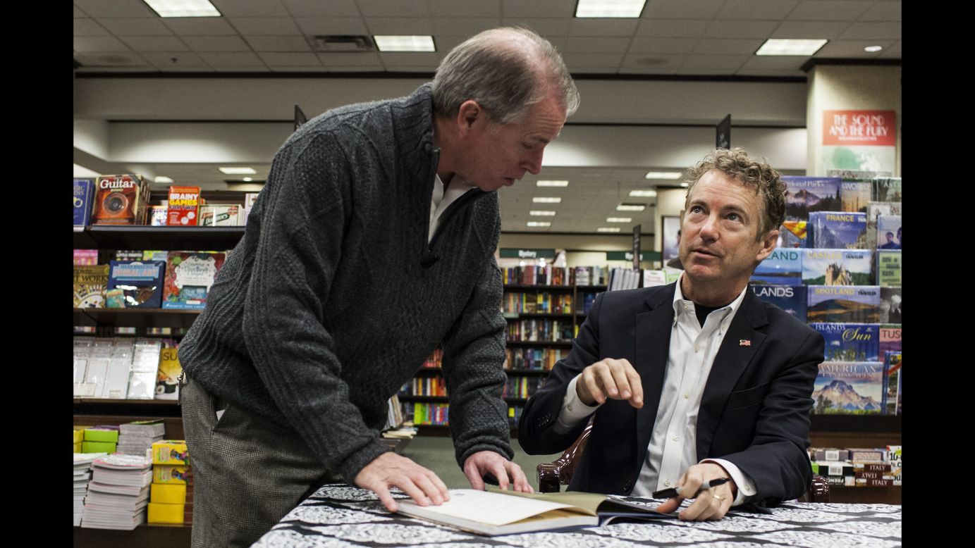 U.S. Sen. Rand Paul, a Republican presidential candidate, signs copies of his book Tuesday, November 24, in Bowling Green, Kentucky.