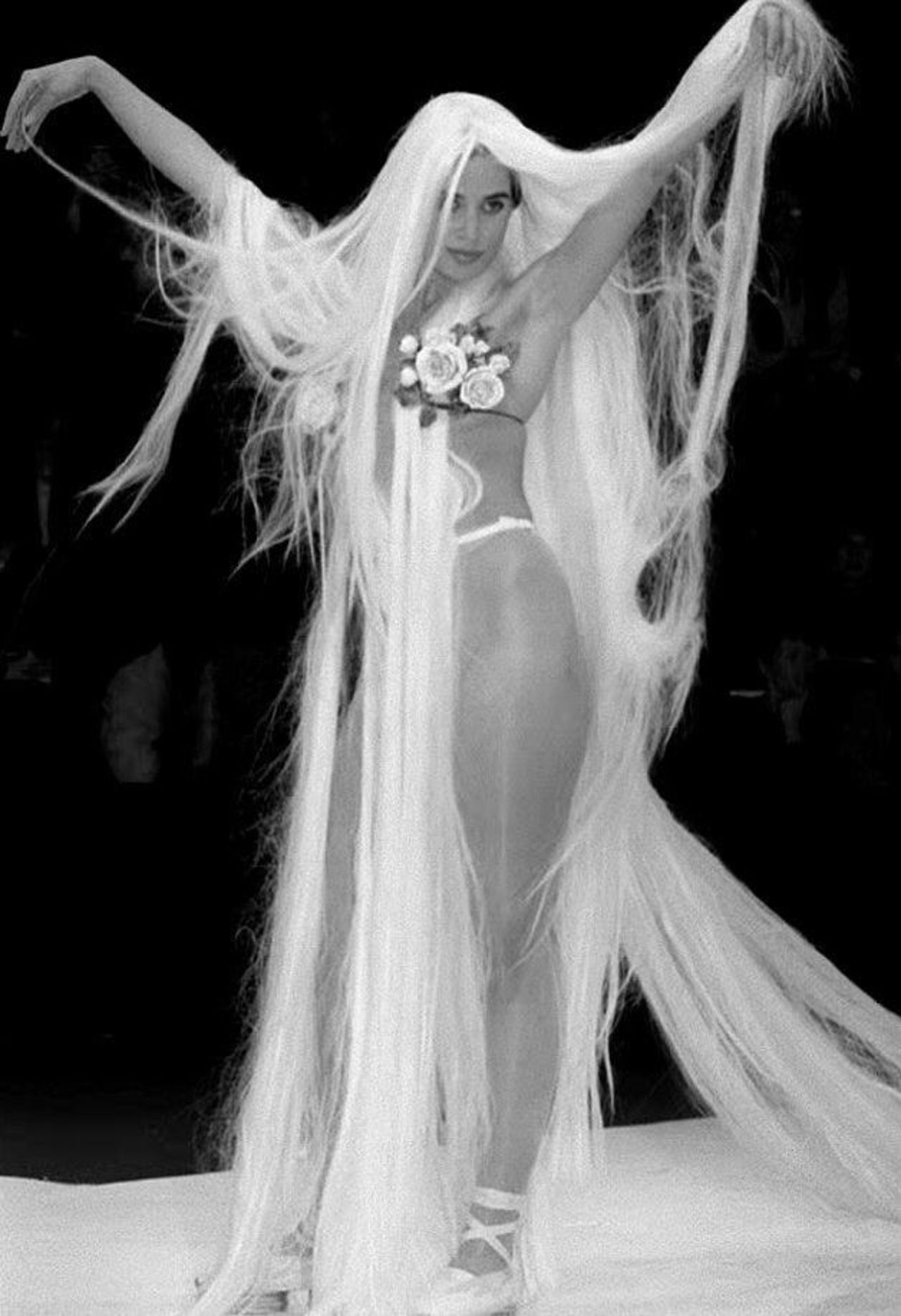 Early on, his risqué and unconventional designs had him branded fashion's enfant terrible by the fashion press. (Pictured: A model walks the catwalk at Jean Paul Gaultier Spring-Summer 1993, 1992)