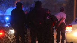 COLORADO SPRINGS, CO - NOVEMBER 27:  A suspect is led away in handcuffs by police during an active shooter situation outside a Planned Parenthood facility where an active shooter reportedly injured up to eleven people, including at least five police officers, on November 27, 2015 in Colorado Springs, Colorado.  Police continue to investigate the scene and are searching the buiding for possible explosive devices. (Photo by Justin Edmonds/Getty Images)