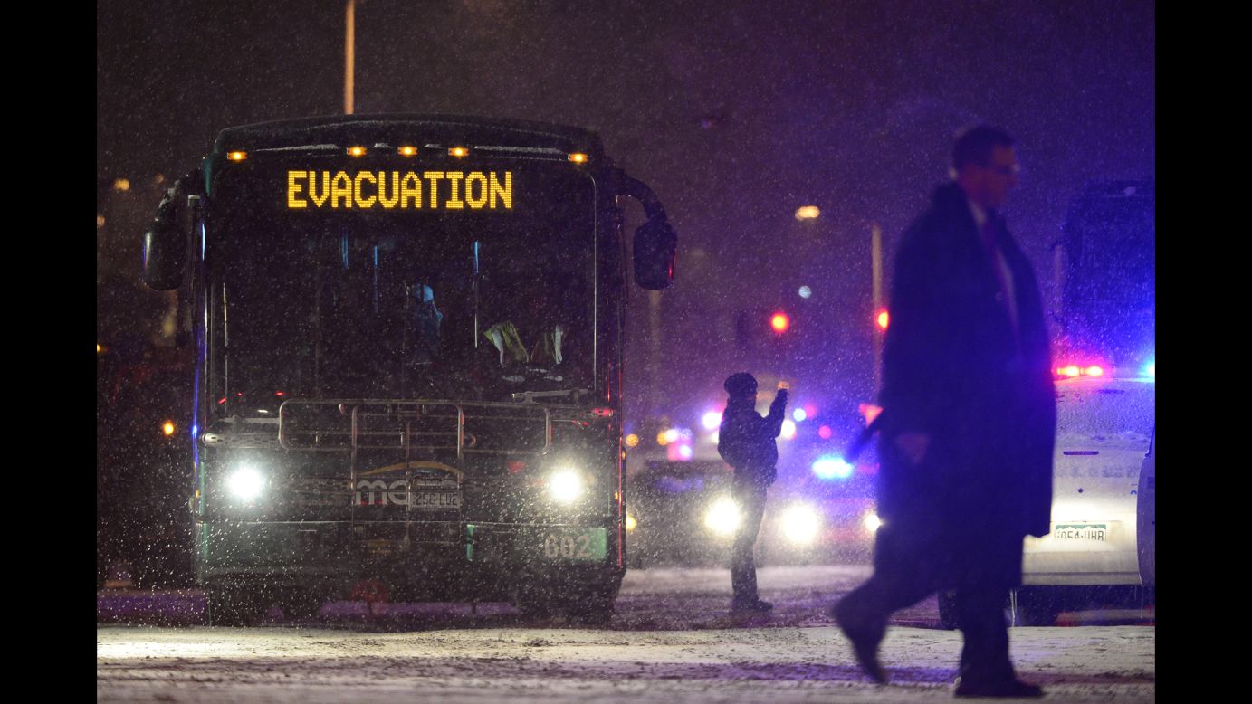 A bus of evacuees make its way towards neighboring hospitals.