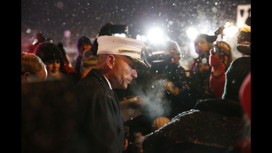 Colorado Springs Fire Department Chief Christopher Riley, center, takes questions from the media.