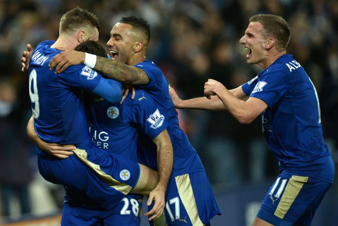 Vardy who has now scored in 11 straight games is mobbed by his teammates after scoring in the 1-1 draw.