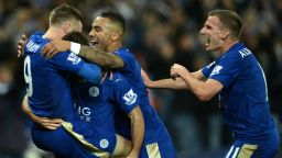 Leicester City's English striker Jamie Vardy (L) celebrates after scoring with Leicester City's Austrian defender Christian Fuchs (2L), Leicester City's English defender Danny Simpson and Leicester City's English midfielder Marc Albrighton during the English Premier League football match between Leicester City and Manchester United at the King Power Stadium in Leicester, central England on November 28, 2015.