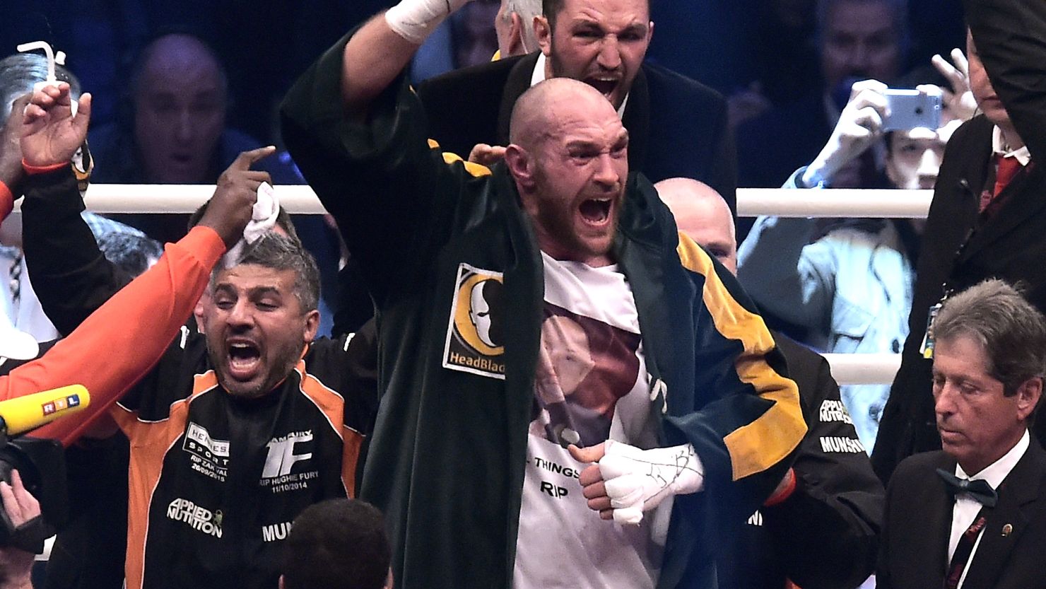 Tyson Fury celebrates after taking the verdict against Wladimir Klitschko to claim the world heavyweight titles. 