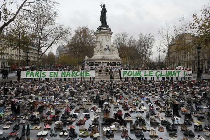 Hundreds of pairs of shoes are displayed at the Place de la République.