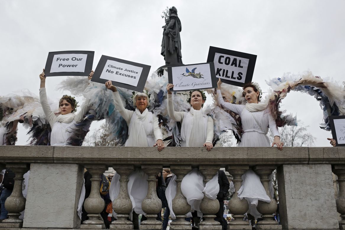 Women dressed as angels pose at the Place de la République.