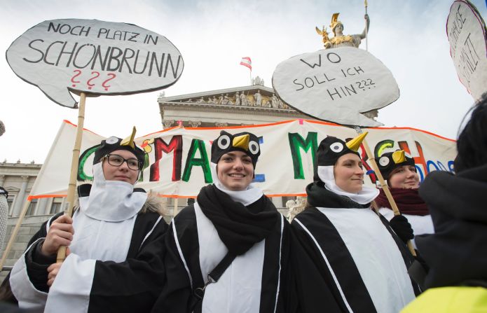 Protesters wearing penguin costumes march in Vienna, Austria.