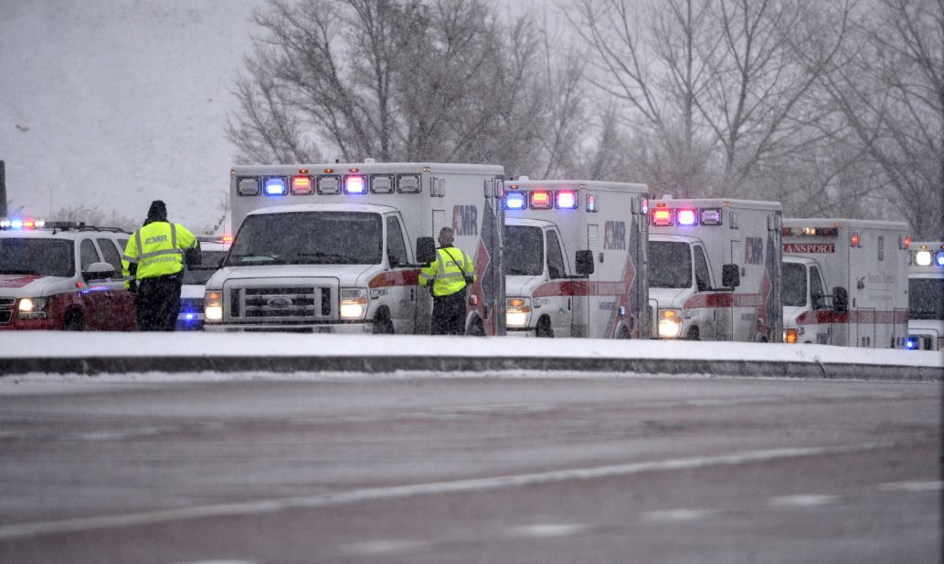 Colorado Springs rescue personnel stand ready near the scene.