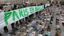 Climate activists organized a silent march in Paris on Sunday to avoid defying a ban on mass protests.
