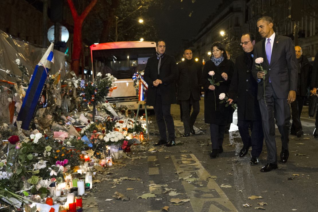 President Barack Obama, French President Francois Hollande, second from right, and Paris Mayor Anne Hidalgo arrive at the Bataclan, site of one of the Paris terrorists attacks, to pay their respects to the victims on Monday  in Paris. (AP Photo/Evan Vucci)