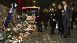 President Barack Obama, French President Francois Hollande, second from right, and Paris Mayor Anne Hidalgo arrive at the Bataclan, site of one of the Paris terrorists attacks, to pay their respects to the victims, after Obama arrived in town for the COP21 climate change conference, on Monday, Nov. 30, 2015, in Paris. (AP Photo/Evan Vucci