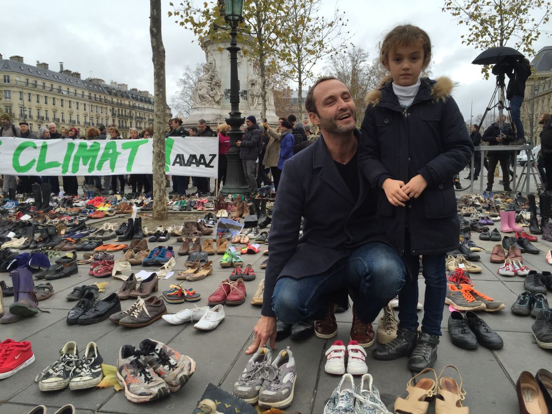 Frederic Vivenot brought his 7-year-old daughter, Chloe, to leave her pink sneakers at the Place de la République in Paris.