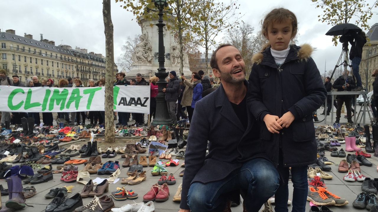 Frederic Vivenot brought his 7-year-old daughter, Chloe, to leave her pink sneakers at the Place de la République in Paris.