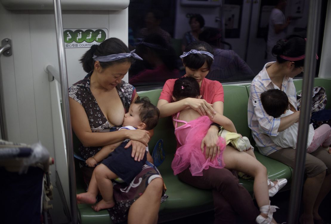 Mothers breastfeed their babies in a subway during an event of the world breastfeeding week on August 1, 2015.  
