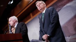 U.S. Sen. Lindsey Graham (R) (R-SC) listens as U.S. Sen. John McCain speaks on the recent bombings by Saudi Arabia in Yemen during a press conference on Capitol Hill March 26, 2015 in Washington, DC.