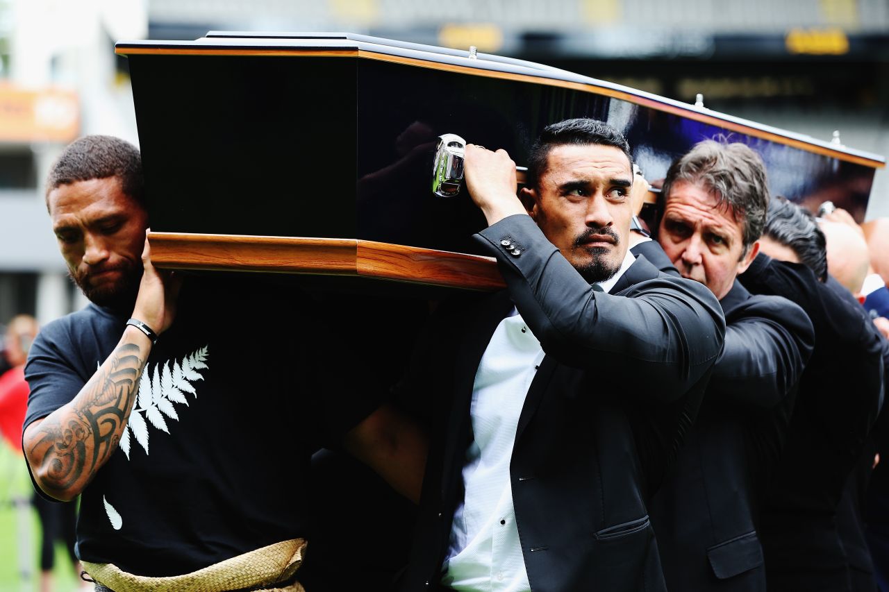 Lomu had suffered from a rare and chronic liver disease since 1995 and died after returning to New Zealand from the Rugby World Cup in England, won by the All Blacks. His coffin was carried into Auckland's Eden Park by Rugby League player Manu Vatuvei (L) and All Blacks player Jerome Kaino, among others.