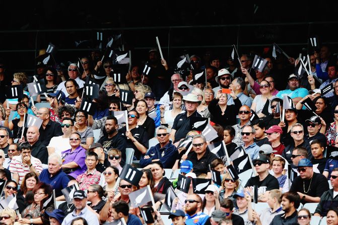 Thousands of people gathered for the memorial service, many holding cards featuring the number 11 -- Lomu's old shirt number. His family are due to hold a private funeral in Auckland on Tuesday.