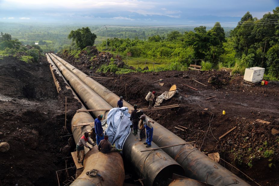 The Matebe hydroelectric plant has to be one of the world's most picturesque construction sites. Workers weld pipes that carry water from the mountains of Virunga and the home of its famous gorillas down an embankment and into a turbine hall that sits above an expansive savannah below.