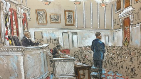 Officer William Porter stands before prospective jurors and Judge Barry Williams.
