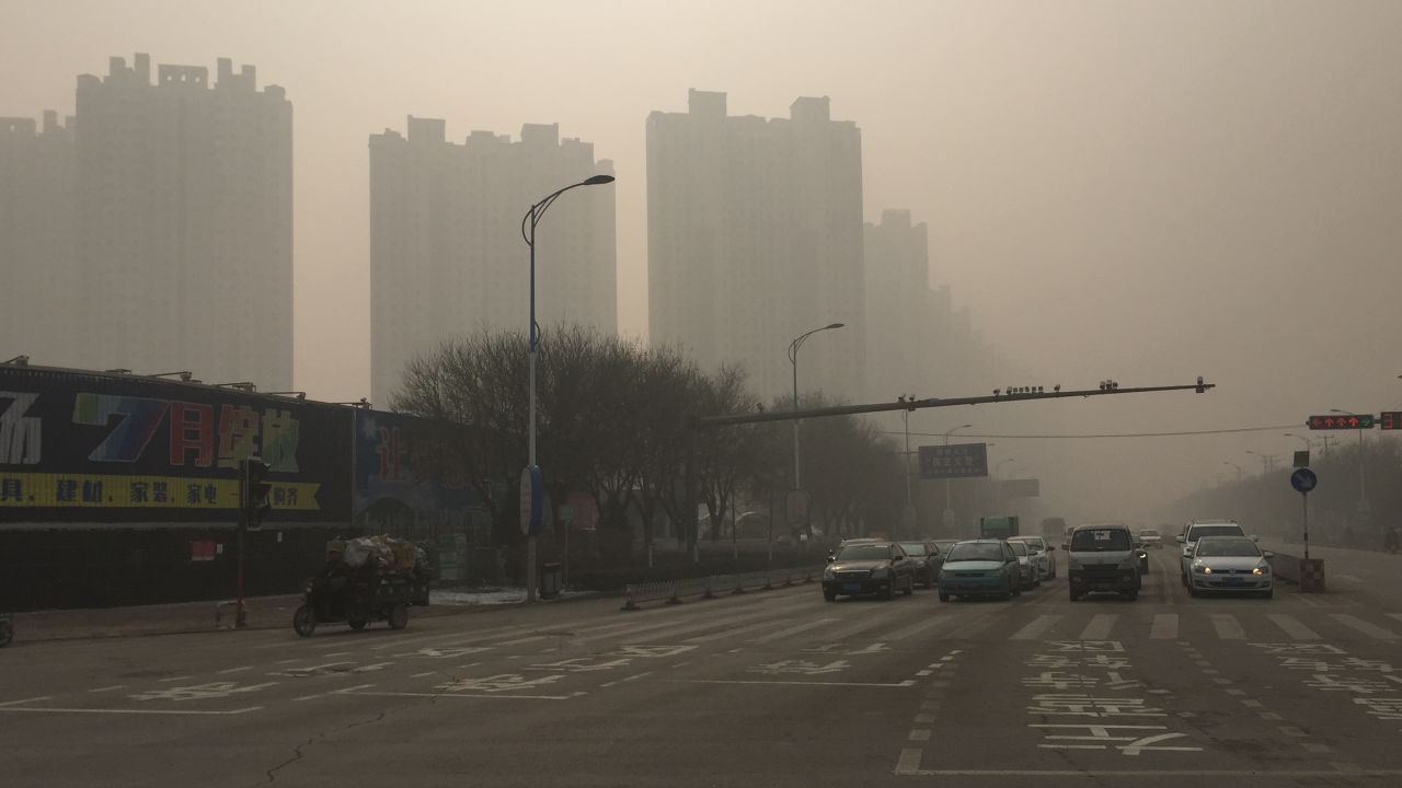 Roads and buildings in Baoding, China are seen shrouded in heavy smog on November 30, 2015, where the air quality index (AQI) has reached a 'hazardous' level.