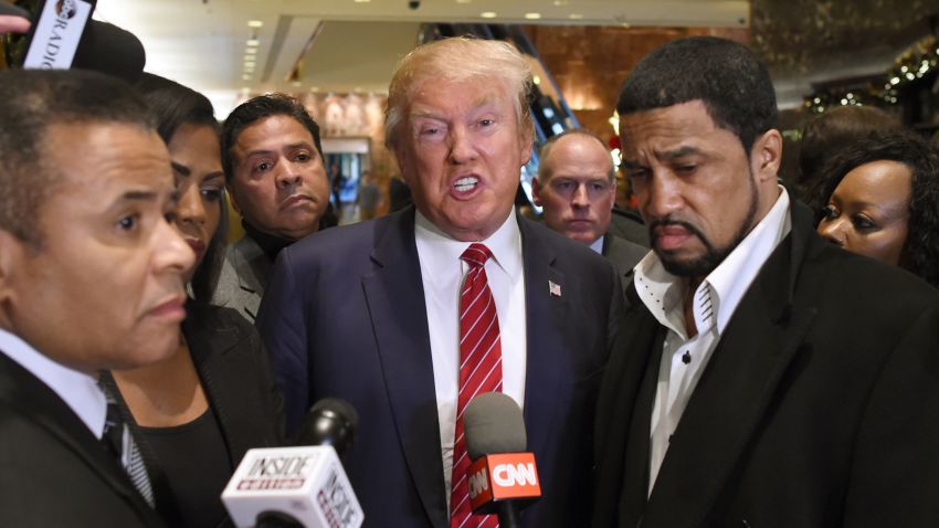 Rev. Darrell Scott, senior pastor of the New Spirit Revival Center in Cleveland Heights (R) and Republican hopeful Donald Trump  speak to the press after a meeting at Trump Tower in New York on November 30 ,2015 with prominent African American clerics. AFP PHOTO / TIMOTHY A. CLARY / AFP / TIMOTHY A. CLARY        (Photo credit should read TIMOTHY A. CLARY/AFP/Getty Images)