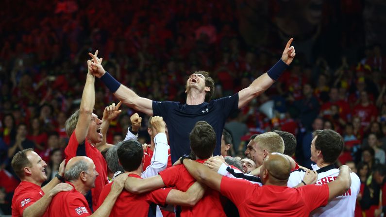 Members of the British Davis Cup team surround Andy Murray after he defeated Belgium's David Goffin <a href="index.php?page=&url=http%3A%2F%2Fwww.cnn.com%2F2015%2F11%2F29%2Fsport%2Fgreat-britain-davis-cup-title-tennis%2F" target="_blank">to win the tennis tournament</a> Sunday, November 29, in Ghent, Belgium. It's the first time Great Britain has won the Davis Cup since 1936.