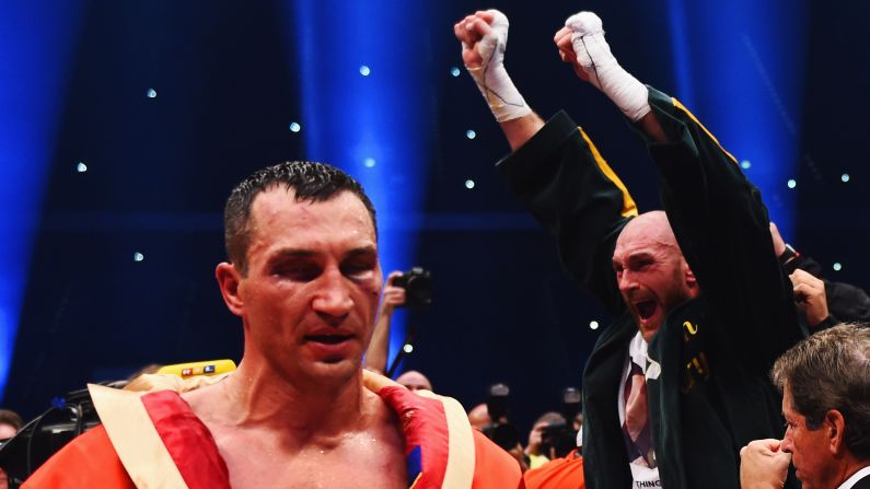 Tyson Fury celebrates Saturday, November 28, after he outpointed Wladimir Klitschko, left, <a href="index.php?page=&url=http%3A%2F%2Fwww.cnn.com%2F2015%2F11%2F29%2Fsport%2Fboxing-fury-klitschko-heavyweight-aerosmith%2F" target="_blank">to become the new heavyweight champion</a> of the world. The unanimous decision in Dusseldorf, Germany, was Klitschko's first loss since 2004.