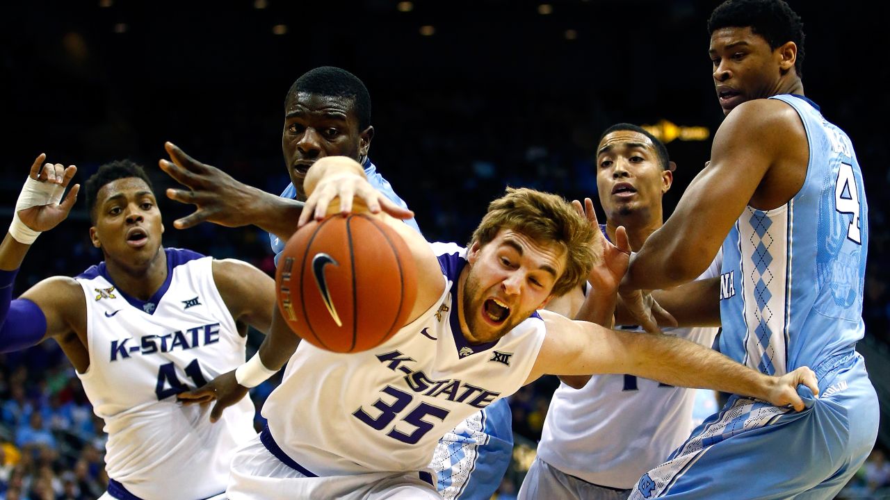 Kansas State's Austin Budke lunges for a loose ball while playing North Carolina in a college basketball game played Tuesday, November 24, in Kansas City, Missouri.