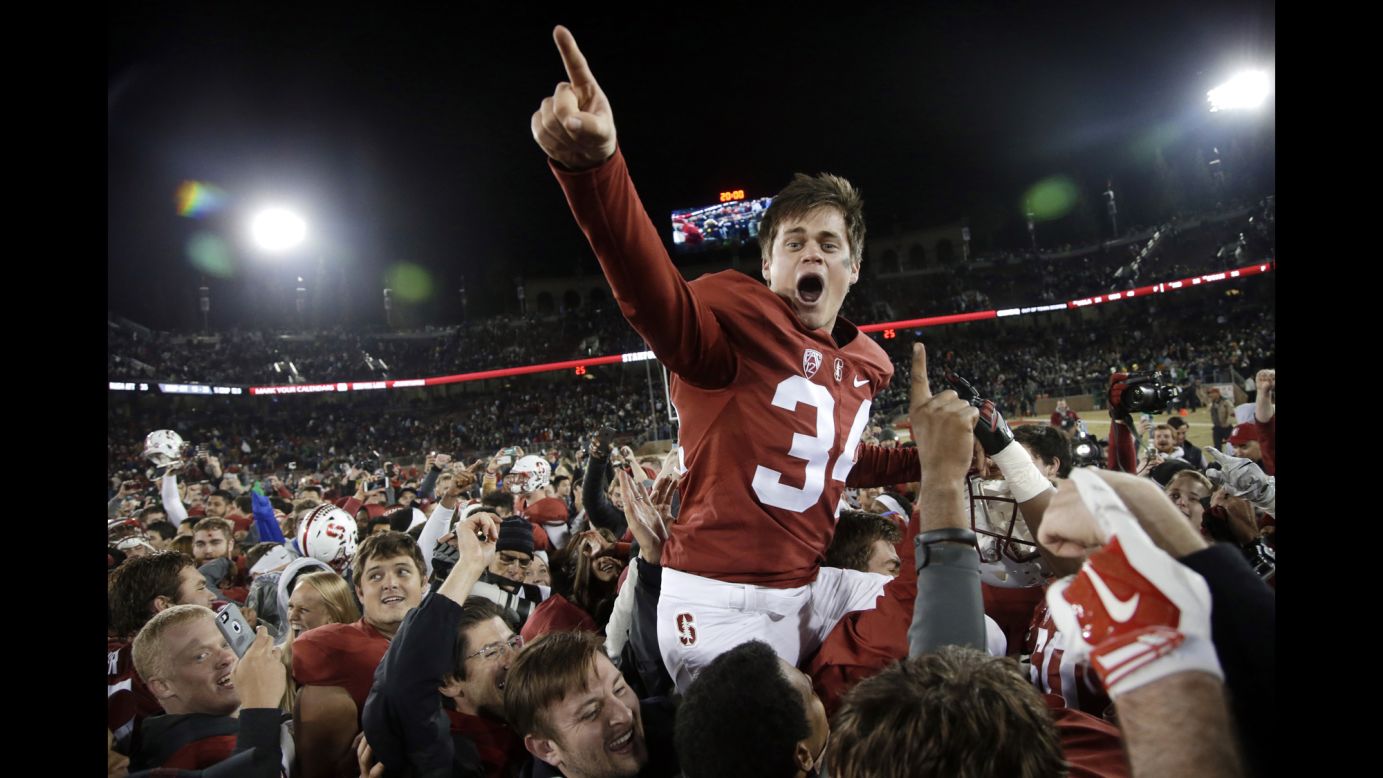 Stanford kicker Conrad Ukropina is carried off the field Saturday, November 28, after his 45-yard field goal defeated Notre Dame 38-36 in Stanford, California.