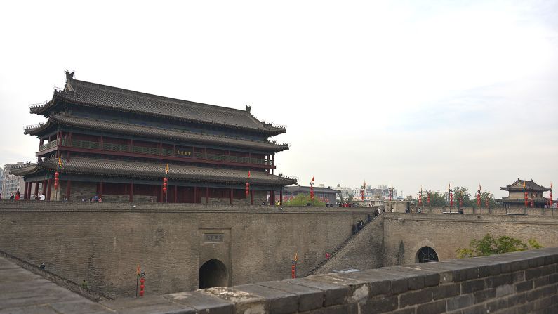 The 14-kilometer-long wall was built in the Ming Dynasty to safeguard Xi'an, a strategic capital for many Chinese dynasties. East Gate (pictured) is one of four original gates. 